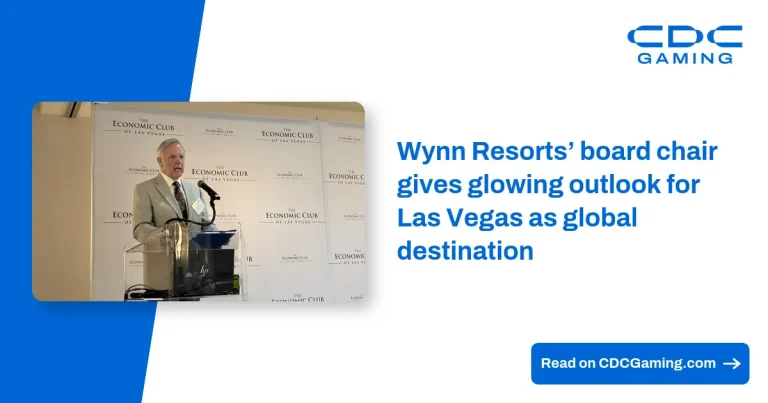 Vista nocturna del exterior de Wynn Las Vegas iluminado.